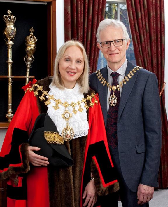 The Mayor of Trafford in ceremonial robes and chains of office, standing with the Consort.