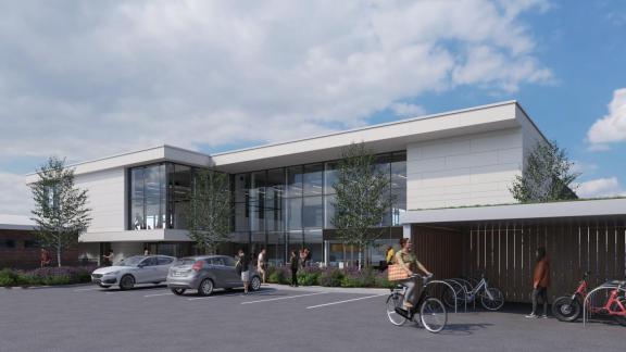 Architectural rendering of a modern two-storey building with a white exterior and large floor-to-ceiling glass windows.