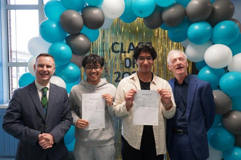 from left, Council leader Tom Ross, Stretford High students Abrar Bin Muzib and Nael Khawaja; Council Executive Member for Babies, Children and Young People, George Devlin. There are balloons in the background